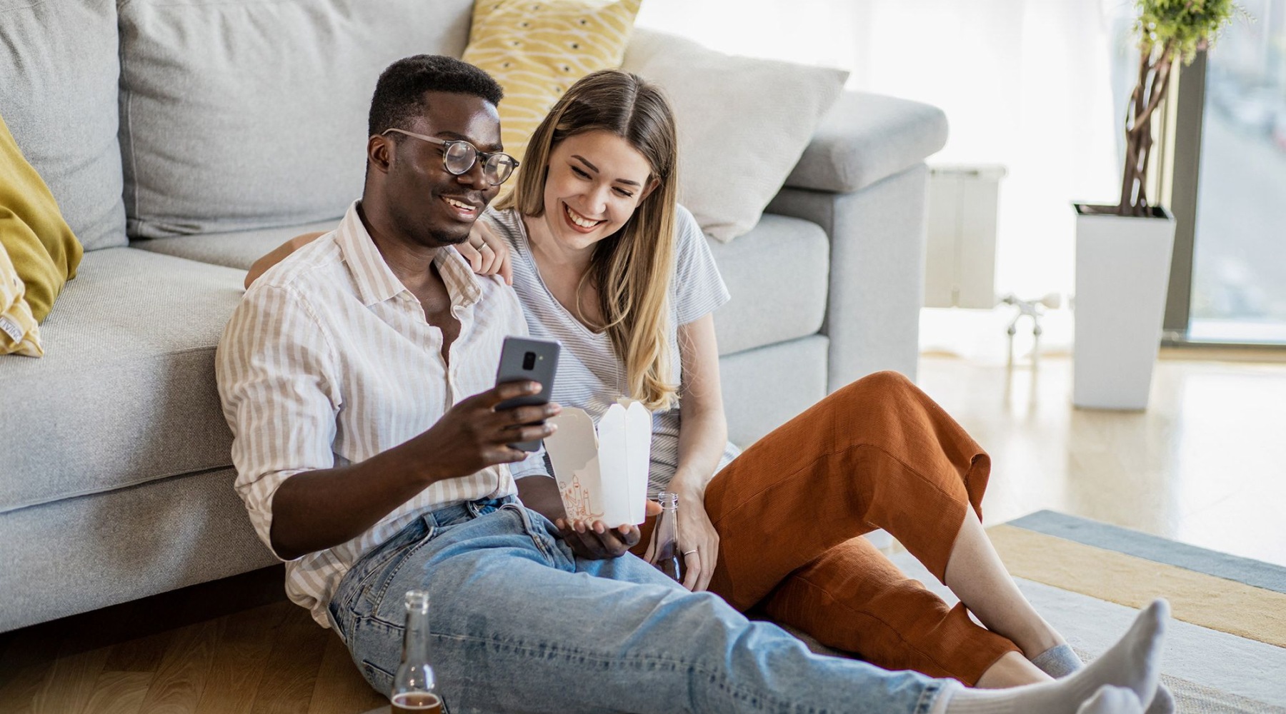 girl and guy looking at a phone
